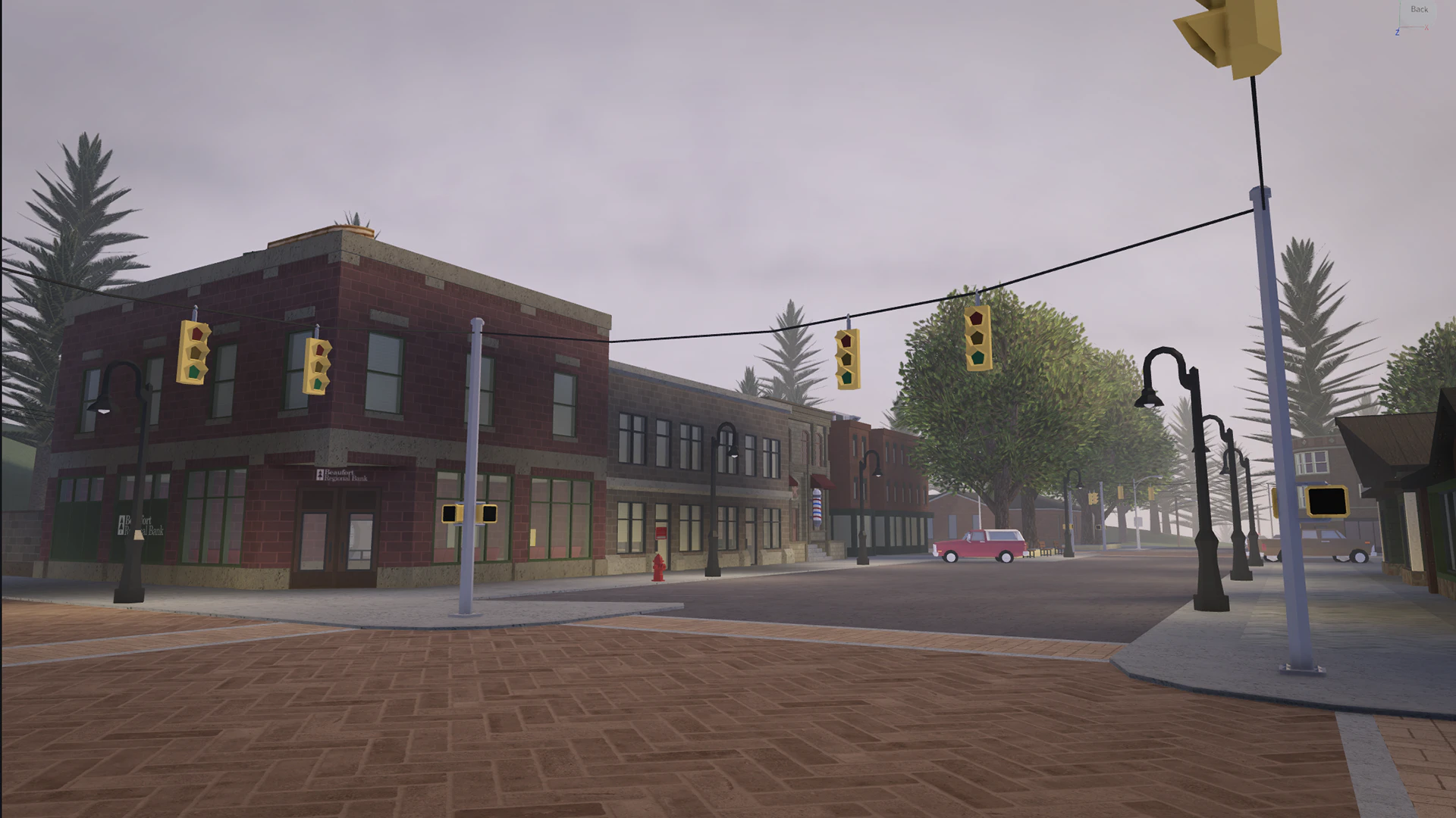 Street corner in Beaufort with brick shopfronts and traffic lights